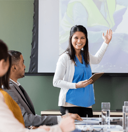 woman giving presentation in conference room